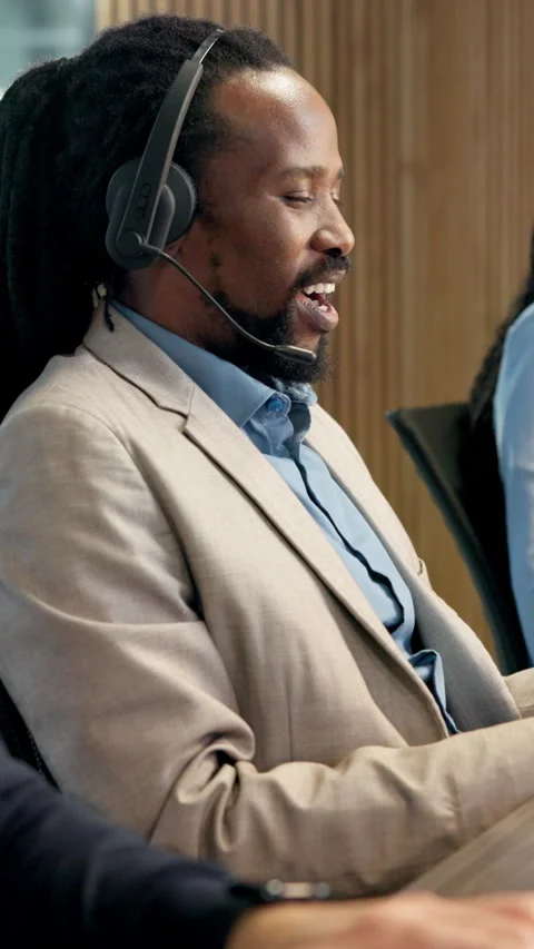 Man, headset and discussion in call center for help, customer support and Stock Footage 343324314