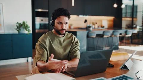 Man, headset and video call at house with laptop, virtual meeting and data .. Stock Photos