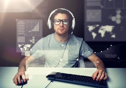 Man in headset with computer over virtual screens Stock Photos