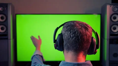 Man with headset interacting with a large computer screen Stock Footage 167167860