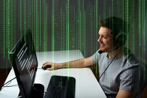 Man in headset playing computer video game at home Photos