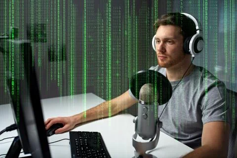 Man in headset playing computer video game at home Photos