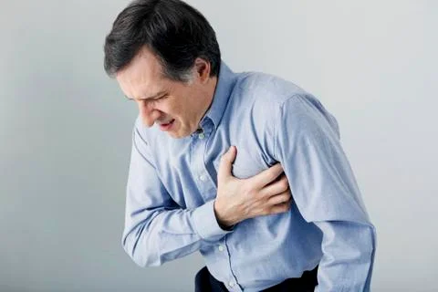 Man with heart attack Stock Photos