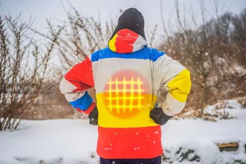A man in a heated winter jacket. Under the jacket heating elements Stock Photos