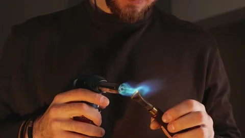 Man heats tool with portable torch. hot tool Stock Footage 173422440
