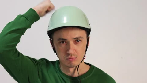 Man in helmet checking safety and durability Stock Footage 344057815