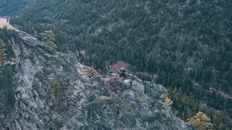 Man helping another man up on Peak of Mountain 3 Video stock 292022932