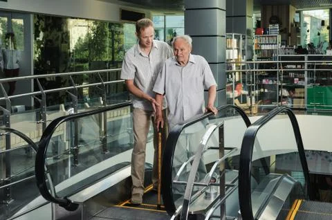 The man is helping the old man. Stock Photos
