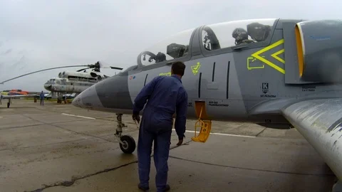 Man helps the crew get out from plane. Assistant open cockpit with pilot. Stock Footage 118677065