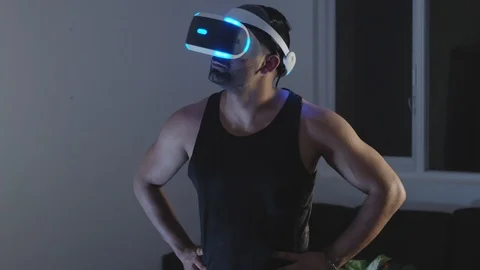 Man Heroically Puts Hands on Hips and looks around in Virtual Reality Video Game Stock Footage 108880720