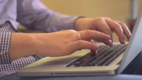 The man hesitantly typing on the laptop Stock Footage 72247619