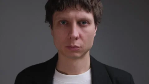 Man hesitates and nods while making a difficult decision, emotional close-up Stock Footage 323217012