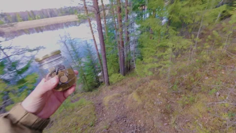 A man hides a jar of valuable coins in the forest. From the first person. 스톡 동영상 334953610