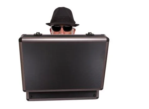 Man hiding behind a case Stock Photos