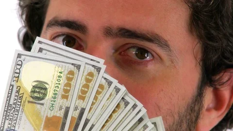 Man Hiding Face Behind USD Dollar Money, Isolated White Background Stock Footage 76515165