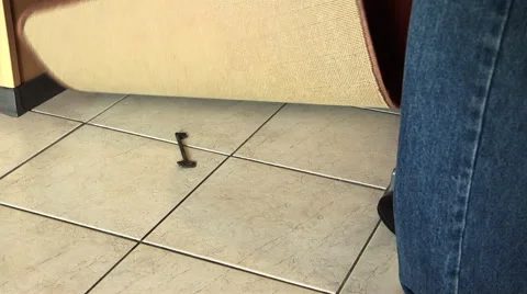 Man is hiding a house key under the mat Stock Footage 50438479