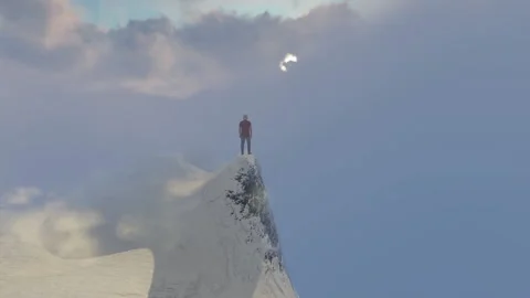 Man on a high peak of a mountain surrounded in fog Stock-Footage 163263569
