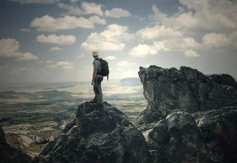 Man on the high peak Stock Photos