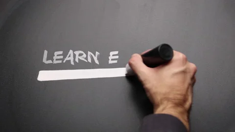 Man highlighting on a blackboard with text "Learn English" Stock Footage 148968373