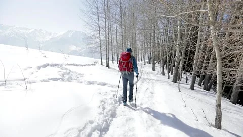 Man hiker with red backpack in winter mountains Stock Footage 171000052