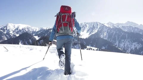 Man hiker with red backpack in winter mountains Stock Footage 171000142