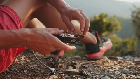 Man hiker Setting Up a Portable gas Camping Stove in the Beautiful Outdoors of Stock Footage 285433850