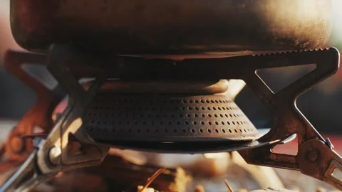 Man hiker Setting Up a Portable gas Camping Stove in the Beautiful Outdoors of Stock Footage 288116526