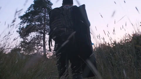 A man hikes along the overgrown path Stock Footage 157051111