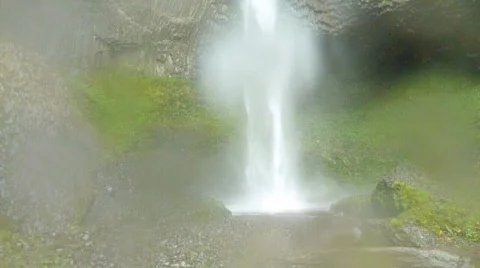 Man Hikes Back from Large Waterfall Stock Footage 874823