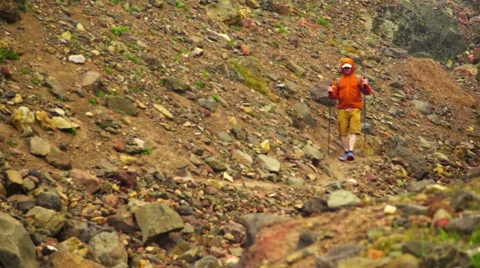 Man hikes down hill Stock Footage 59522034