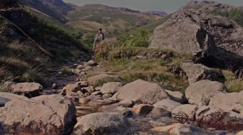 Man hikes mountain trail Stock Footage 41939481