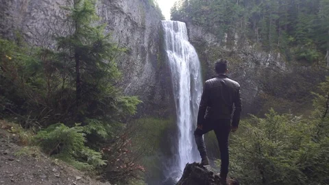 Man Hikes to Pristine Waterfall in Oregon Slow Motion Stock Footage 98862980