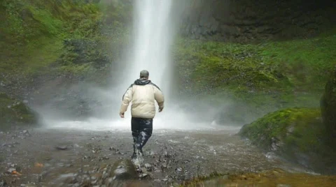 Man Hikes into Waterfall 1 Stock Footage 874893