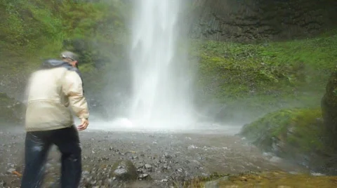 Man Hikes into Waterfall 2 Stock Footage 874910