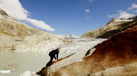 Man hiking alone in mountain landscape scenery. adventures trekking climbing Stock Footage 64799559