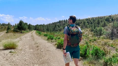 Man Hiking Alone on Mountain Trail, Ground Level View Tracking Shot Stock Footage 338007402