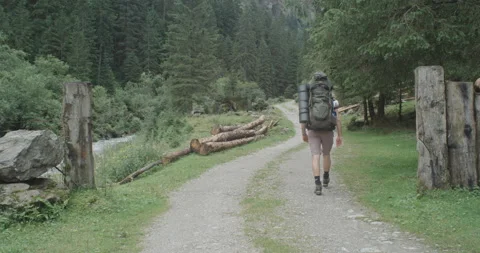 Man Hiking In The Austrian Alps With Backpack Stock Footage 228949641