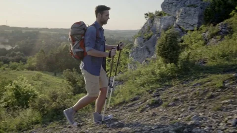 Man hiking with backpack during summer sunny day Stock Footage 76313747