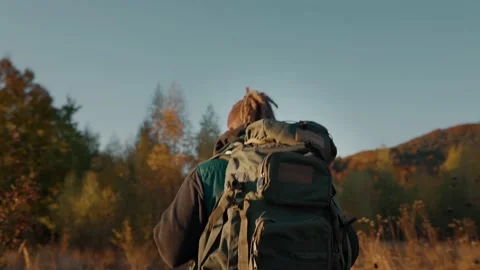 Man with a hiking backpack Stock Footage 194271818
