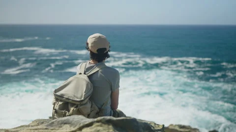 Man hiking close to big cliffs and heavy ocean in Basque Coast, Spain Video stock 154766965