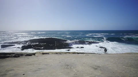 Man hiking close to big cliffs and heavy ocean in Basque Coast, Spain Video stock 154768666