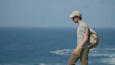 Man hiking close to big cliffs and heavy ocean in Basque Coast, Spain Video stock 154769989
