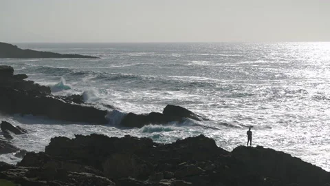 Man hiking close to big cliffs and heavy ocean in Basque Coast, Spain Video stock 154775157