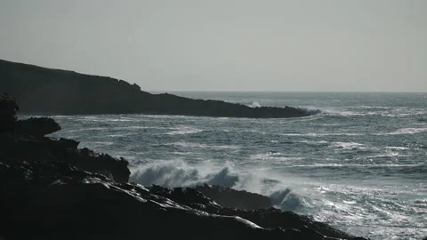 Man hiking close to big cliffs and heavy ocean in Basque Coast, Spain Video stock 154775570