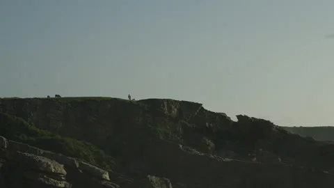 Man hiking close to big cliffs and heavy ocean in Basque Coast, Spain Video stock 154775613