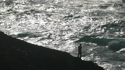Man hiking close to big cliffs and heavy ocean in Basque Coast, Spain Video stock 154775640
