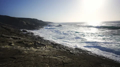 Man hiking close to big cliffs and heavy ocean in Basque Coast, Spain Video stock 154775650