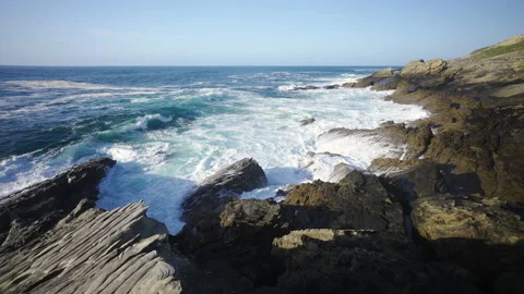 Man hiking close to big cliffs and heavy ocean in Basque Coast, Spain Video stock 154775778