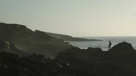 Man hiking close to big cliffs and heavy ocean in Basque Coast, Spain Video stock 154775990