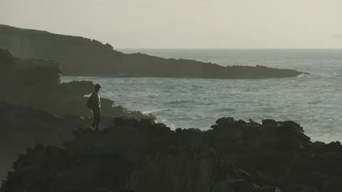Man hiking close to big cliffs and heavy ocean in Basque Coast, Spain Video stock 154776509